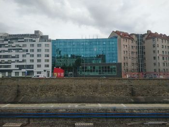 Buildings in city against sky