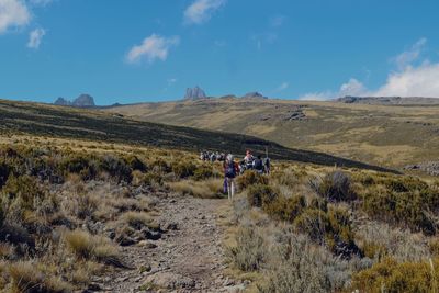 A group of hikers in the volcanic landscapes of mount kenya