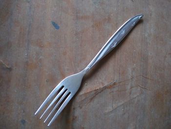 High angle view of fork on table