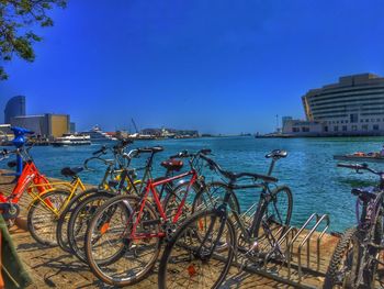 Bridge over river against clear blue sky
