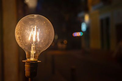 Close-up of illuminated light bulb