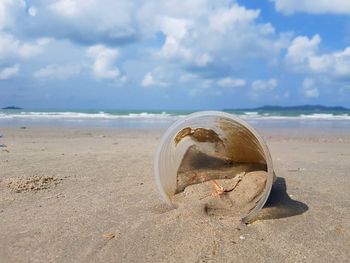 Plastic grass on sandy beach