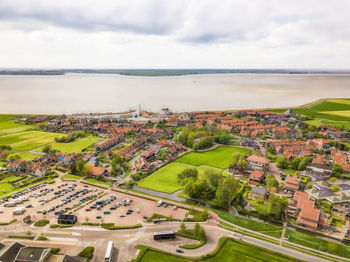 High angle view of buildings in city against sky