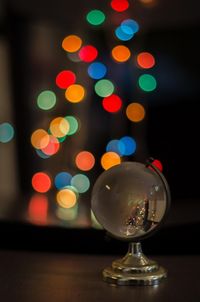 Close-up of illuminated christmas lights on table