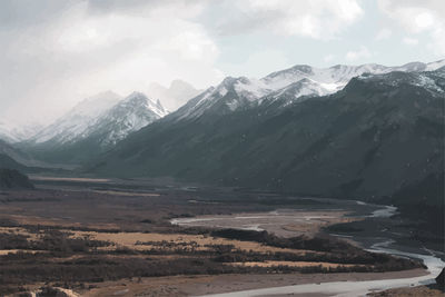 Scenic view of snowcapped mountains against sky