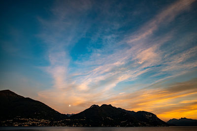 Scenic view of silhouette mountains against sky during sunset