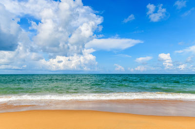 Beautiful beach and sea with blue sky background at mai khao beach phuket, thailand.