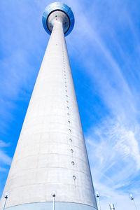 Low angle view of communications tower against sky