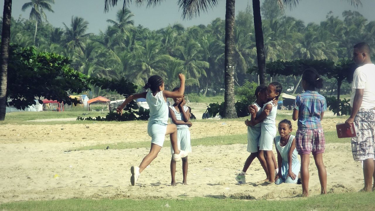 lifestyles, full length, togetherness, casual clothing, leisure activity, tree, bonding, men, love, grass, friendship, field, person, boys, standing, green color, childhood, day