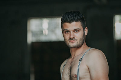 Portrait of young man looking at camera