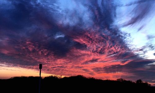 Low angle view of dramatic sky during sunset