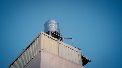 Low angle view of building against blue sky