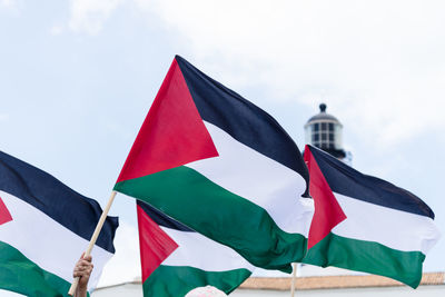 Protesters are seen holding the palestinian flag during a peaceful protest 