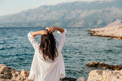Rear view of woman looking at sea