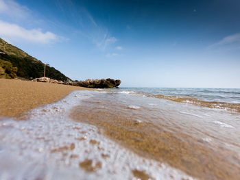 Scenic view of beach against sky