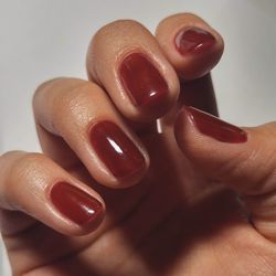 Close-up of hand holding ice cream