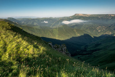 Scenic view of mountains against clear sky