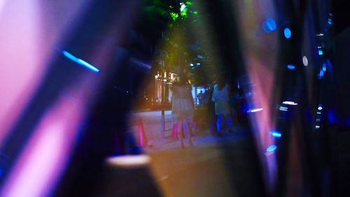 Defocused image of illuminated street lights at night