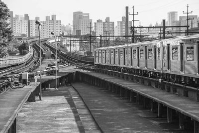 Railroad in city against sky. subway estation.