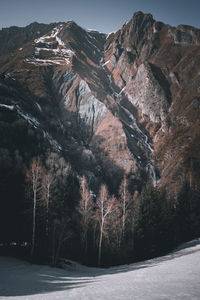 Scenic view of snow covered mountains against sky