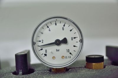 Close-up of clock on table