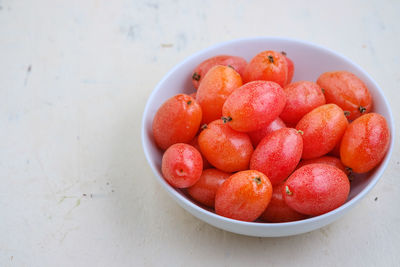 High angle view of strawberries in bowl on table