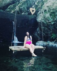 Woman sitting in water