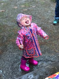 Close-up of cute girl standing outdoors