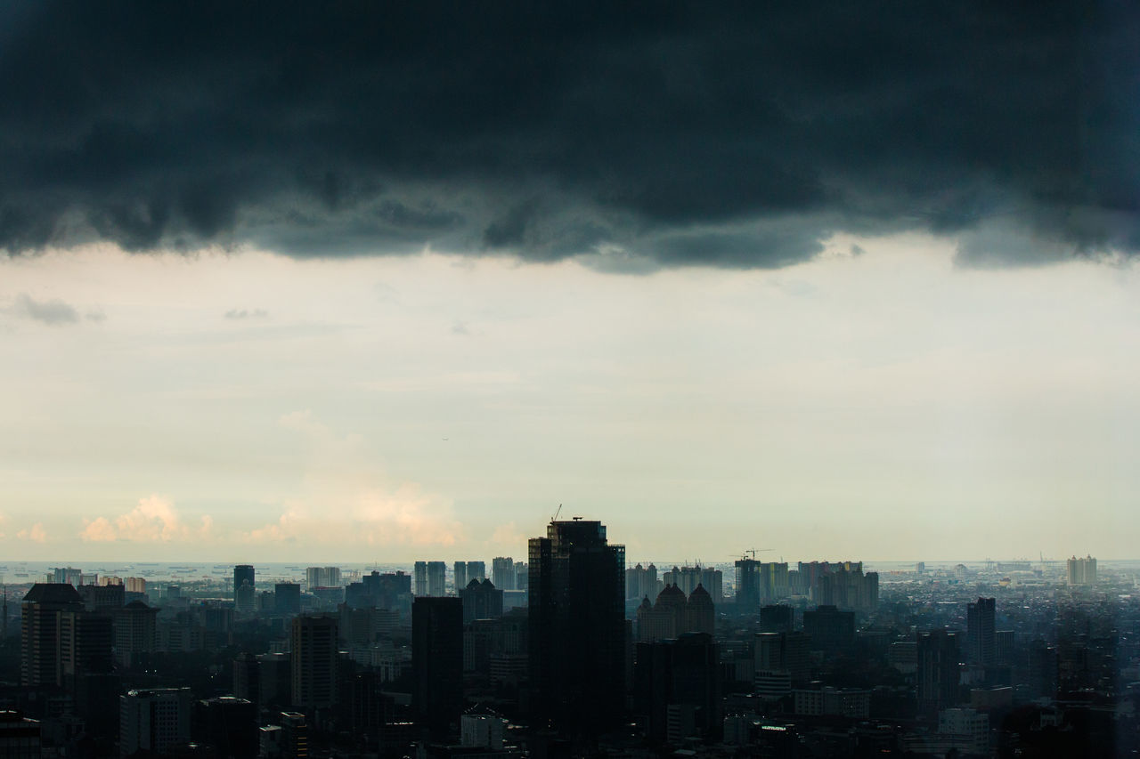 BUILDINGS IN CITY AGAINST SKY