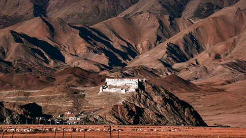 High angle view of desert against mountain range