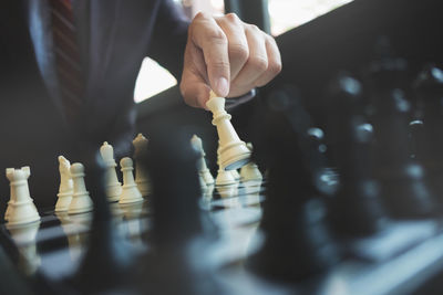 Full length of man playing on chess board