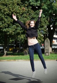 Young woman standing in park