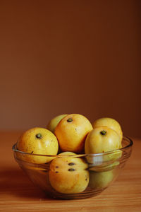 Close-up of fruits in bowl on table