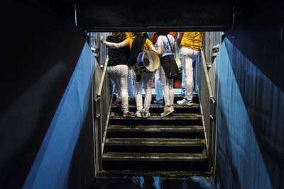 Low section of people walking on steps