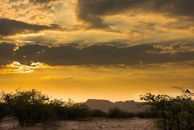 Scenic view of landscape against sky during sunset