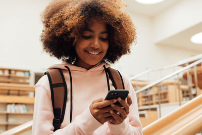 Young woman using mobile phone