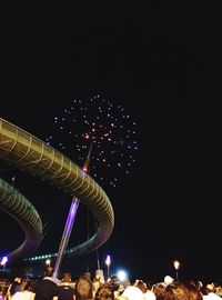 Low angle view of illuminated ferris wheel