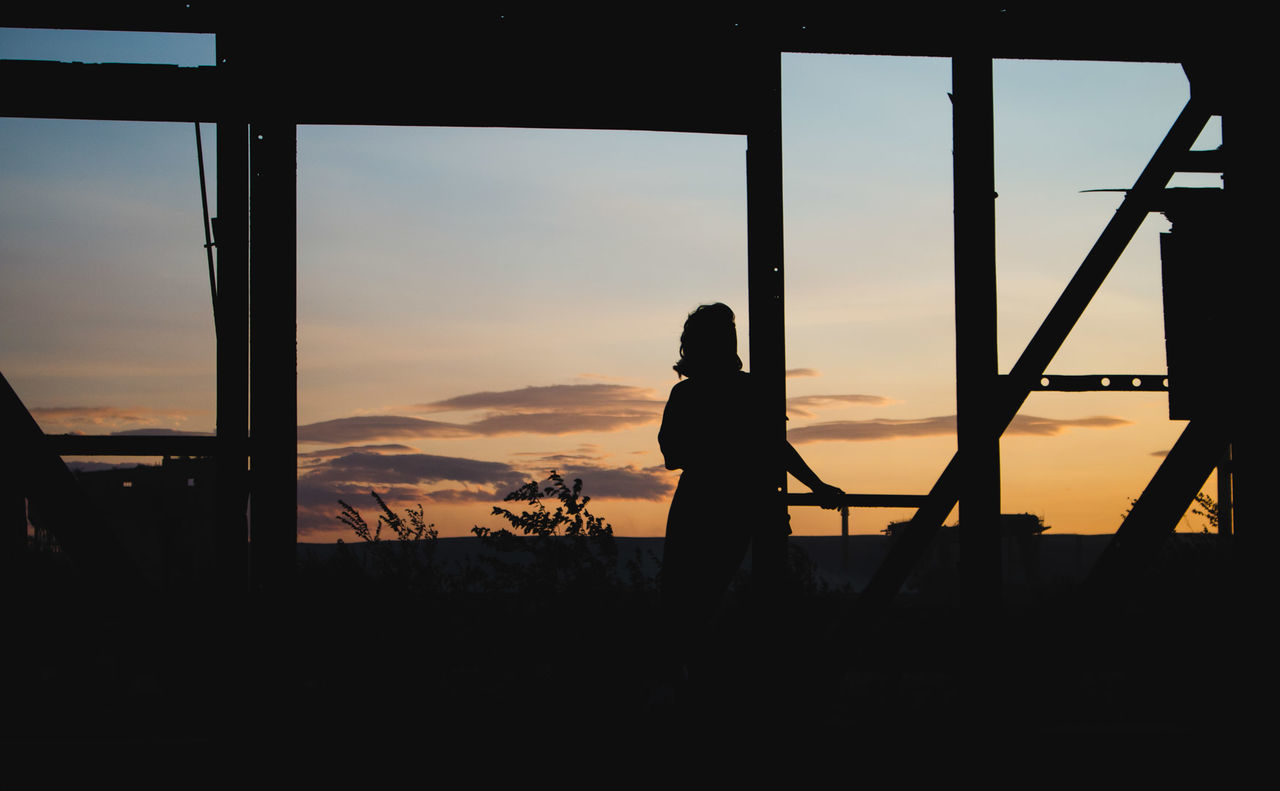 SILHOUETTE PEOPLE STANDING AGAINST ORANGE SKY