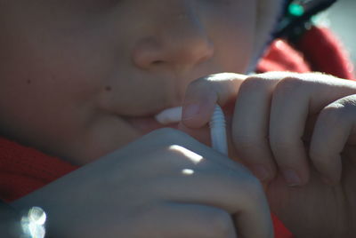 Close-up of child holding hands