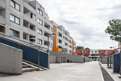 Street amidst buildings against sky