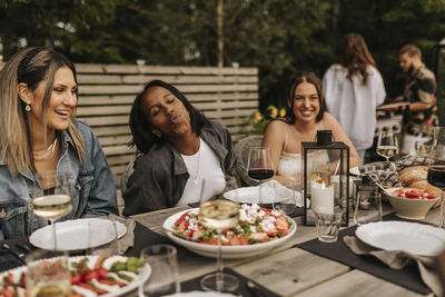 Friends having meal in garden