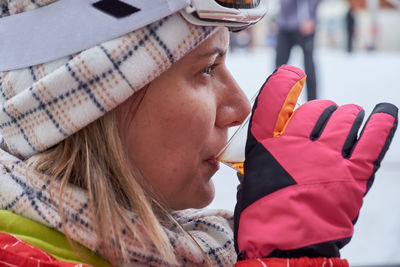 Close-up of woman drinking alcohol