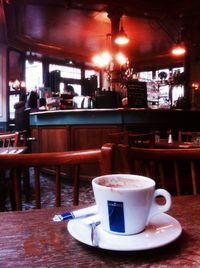 Close-up of coffee served on table at cafe