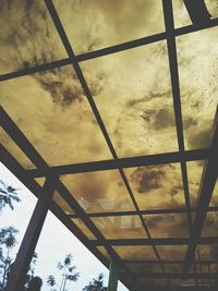 Low angle view of silhouette trees against sky