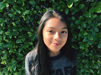 Portrait of smiling young woman outdoors