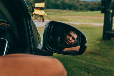 Portrait of man driving car