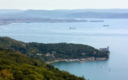 High angle view of sea and buildings in city