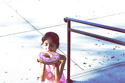 Girl eating boy with umbrella