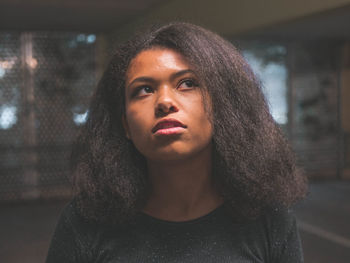 Close-up portrait of a serious young woman