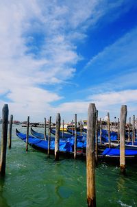 View of pier in calm blue sea